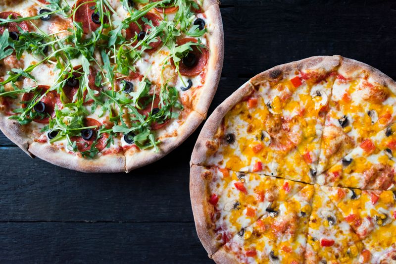 Veggie garden pizza loaded with fresh vegetables at pizza factory